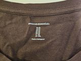 the back of a brown t - shirt with the words amazon essentials printed on it