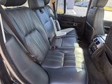 the back seats of a car with black leather seats in a vehicle