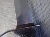 a close up of a knife on a piece of cloth