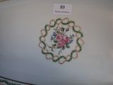 a white plate with a floral design on it