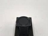 a close up of a smart watch sitting on top of a stand