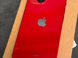 a red iphone is sitting on top of a cardboard box