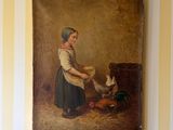 un tableau représentant une femme en train de nourrir un poulet, accroché au mur