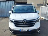 the front view of a white van parked in a parking lot
