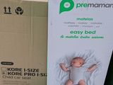a box with a baby in it sitting on a shelf