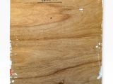 a close up of a piece of wood with writing on it