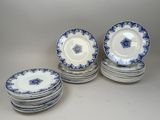 six blue and white china plates with blue flowers on them