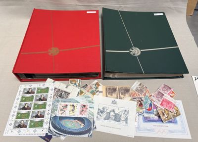 a table with a lot of stamps and a book on it