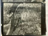an old black and white photo of a river running through a city