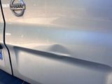 a close up of a car ' s door handle with a sticker on it