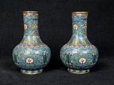 pair of chinese cloise vases on black background with black background