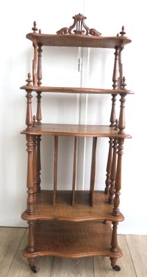 a wooden shelf that has a book shelf on top of it