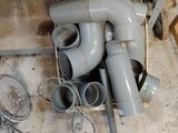 a pile of pipes and other items on the floor