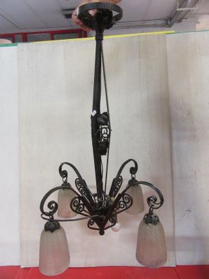 a chandelier hanging from the ceiling in a room