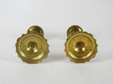 pair of antique brass door knobs on a white background