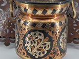 two vases sitting next to each other on a table