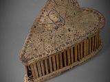 a heart shaped comb sitting on top of a table
