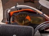 a close up view of a motorcycle ' s dashboard and glasses