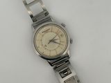 an image of a wrist watch sitting on a white surface