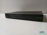 a black dvd player sitting on top of a white table