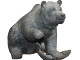 a statue of a bear that is sitting on its hind legs