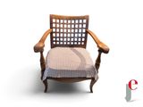 a wooden chair with a striped seat pad on it