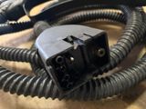 a close up of a black electrical wire on a table