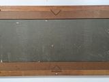a wooden frame with a chalk board on it