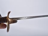 a person holding a sword in their hand
