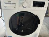 a washing machine that is sitting on the floor