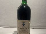 a bottle of wine that is sitting on a table