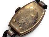 a small metal object that is on a string