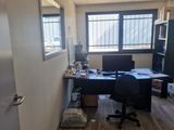 a room with a desk and a chair in it
