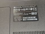 a close up of a laptop that has a sticker on it