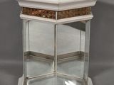 an image of a glass display case with a mirror on top