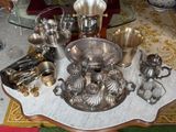 a table with a lot of silver items on it