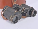 two binoculars sitting next to each other on a white surface