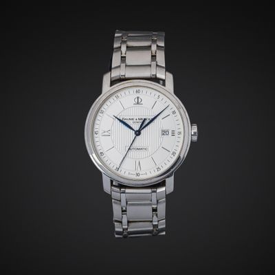 BAUME ET MERCIER. Montre bracelet en acier, boîtier rond, ca…