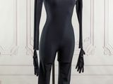the mannequin is standing on a metal stand in front of a white wall