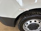 a close up of a tire on a white car