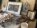 a table with a lot of old pictures and pictures on it