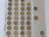 a lot of coins in a plastic bag on the table