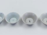 three cups that are sitting next to each other on a table