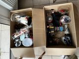 two boxes with items in them sitting on the floor