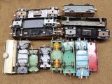 many different parts of a train sitting on the ground