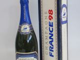 an image of a bottle of champagne next to a box of wine