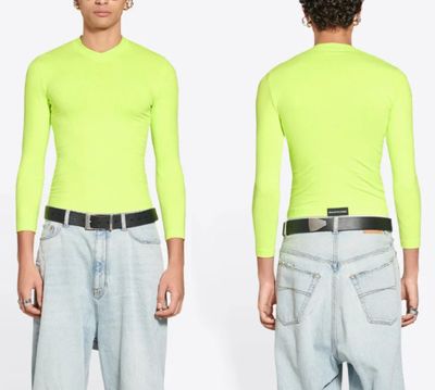an image of a man wearing a neon green shirt and jeans