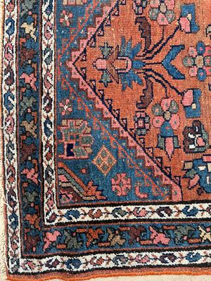 a close up of a rug on a white surface