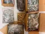 many different types of screws and nuts in a box