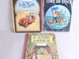 trois livres pour enfants posés sur une table devant un fond blanc